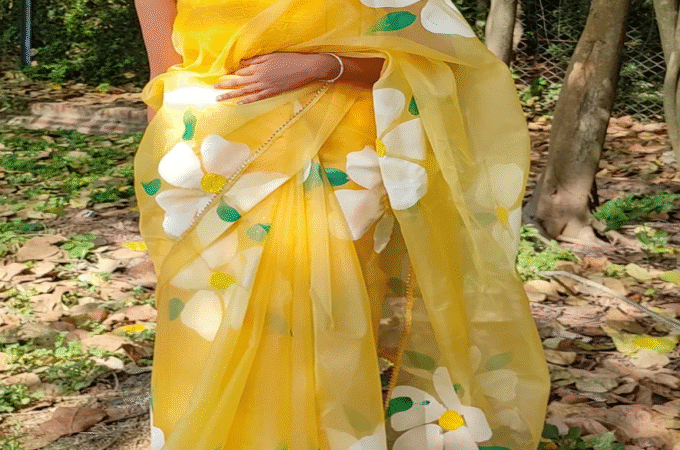 Timeless Elegance with Gulmohar Sarees, Gold Jhumkas, and Silver Necklaces